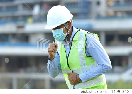 Indian construction worker coughing Indian construction worker coughing 14991840