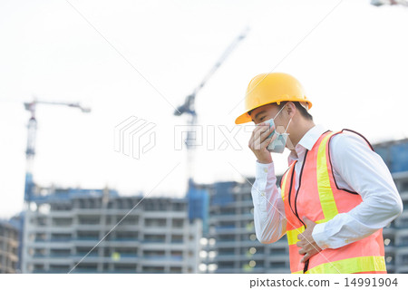 Chinese construction worker coughing Chinese construction worker coughing 14991904