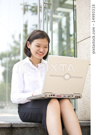 Asian young female executive using laptop Asian young female executive using laptop 14993318