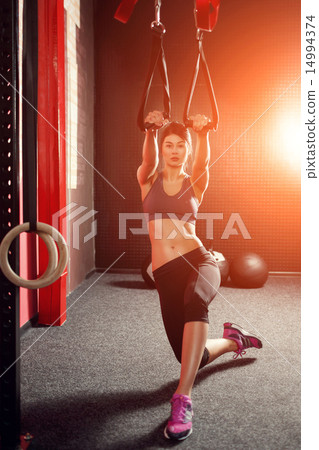 Stock Photo: Crossfit training TRX straps