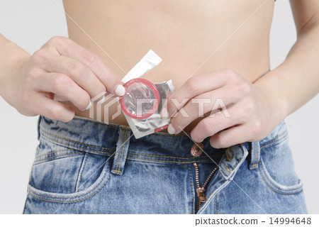 Women's hand to take out condoms Women's hand to take out condoms 14994648