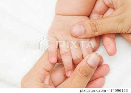 Mother hand massaging hand  of her baby 14996133