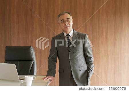 Businessman holding hands at the desk Businessman holding hands at the desk 15000976
