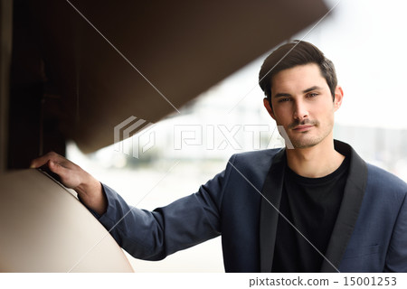 Handsome man, model of fashion, wearing modern suit. 15001253