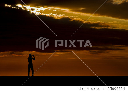 photo of a photographer in the sunset photo of a photographer in the sunset 15006324