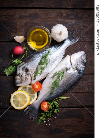Raw dorada with ingredients 15009995
