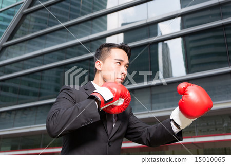 Businessman with boxing gloves Businessman with boxing gloves 15010065