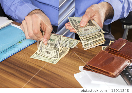Counting dollars banknotes Counting dollars banknotes 15011248