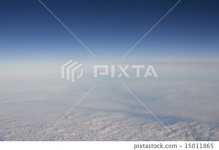 Blue sky with clouds seen from plane window Blue sky with clouds seen from plane window 15011865