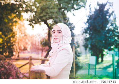 young beautiful muslim woman at the park 15014743