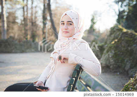 young beautiful muslim woman at the park 15014969