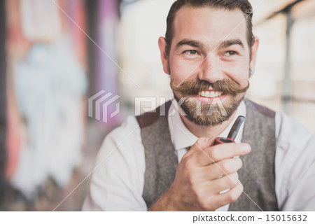 handsome big moustache hipster man smoking pipe 15015632