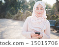 young beautiful muslim woman at the park 15015706