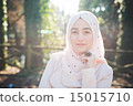 young beautiful muslim woman at the park 15015710