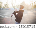 young crazy funny asian man in town outdoor lifestyle listening 15015715