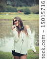 young beautiful brunette woman girl listening music headphones 15015716