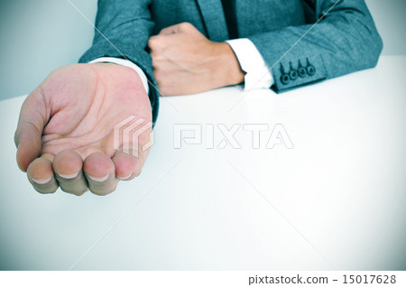 man in suit with an outstretched hand 15017628
