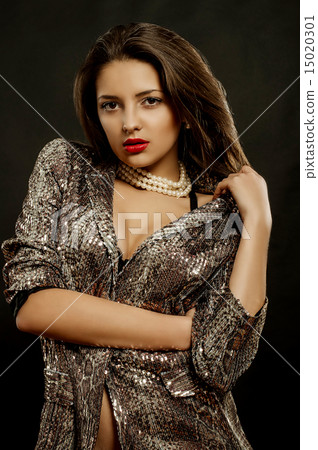 Girl with dark hair and beautiful jewelry Girl with dark hair and beautiful jewelry 15020301