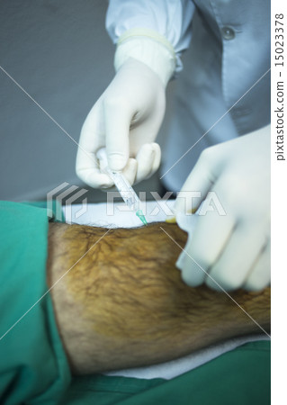 Surgeon doctor injecting patient in hospital  15023378