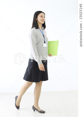 Middle business woman walking with documents Middle business woman walking with documents 15025140