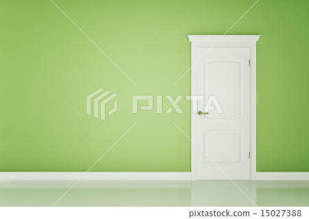 Closed white door on green wall 15027388