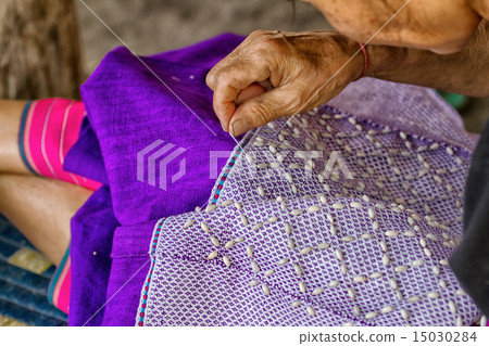 Woman hand stitching cloth make Thai fabric Woman hand stitching cloth make Thai fabric 15030284