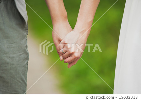 man and woman holding hands. young couple in love 15032318