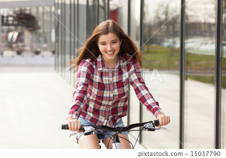 Young beautiful woman on a bicycle 15037790