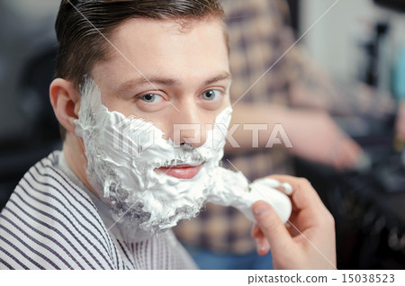 Client shaving at barber shop Client shaving at barber shop 15038523