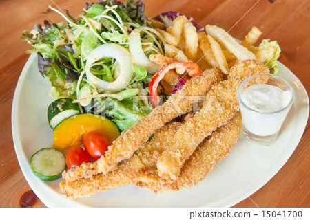 Traditional English food  Fish and chips and salad 15041700