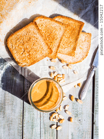 ruddy toast with peanut butter breakfast, top view ruddy toast with peanut butter breakfast, top view 15042217