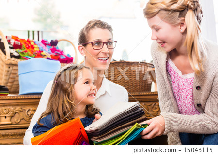 Family buying supplies  in handicraft store 15043115