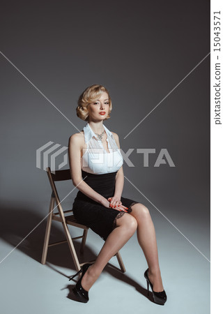 Pin-up girl young and beautiful woman portrait on gray background Pin-up girl young and beautiful woman portrait on gray background 15043571