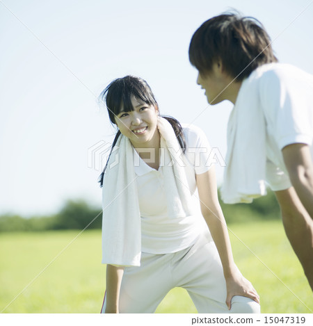 A couple preparing campaigning in the meadow A couple preparing campaigning in the meadow 15047319