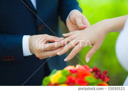 hands of bridal couple with wedding rings 15050121