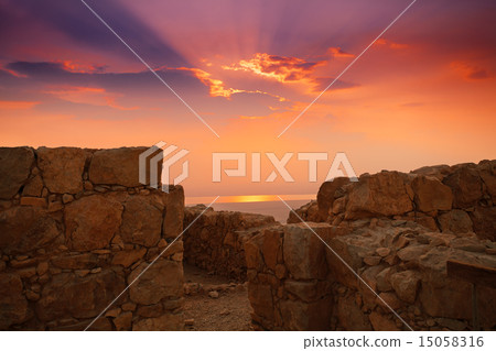 Beautiful sunrise over Masada fortress 15058316