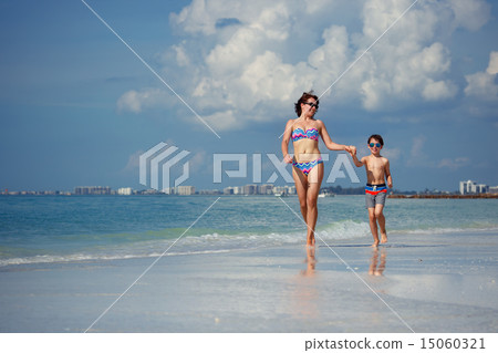 Mother and son on tropical beach 15060321
