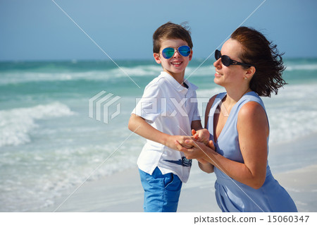 Mother and son on tropical beach 15060347