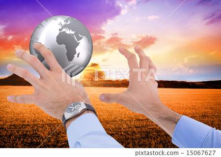Composite image of businessman holding something with his hands Composite image of businessman holding something with his hands 15067627