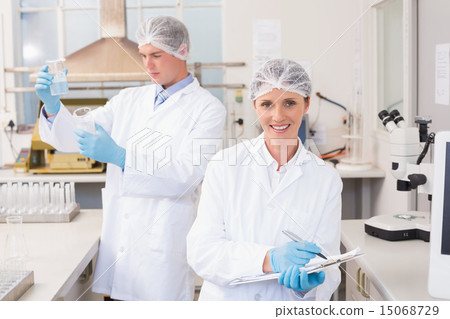 Smiling scientist looking at camera 15068729