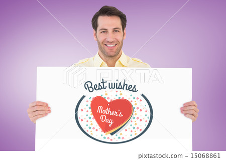 Composite image of attractive man smiling and holding poster Composite image of attractive man smiling and holding poster 15068861