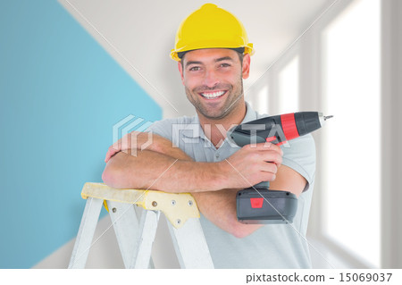 Composite image of male technician holding power drill on ladder 15069037