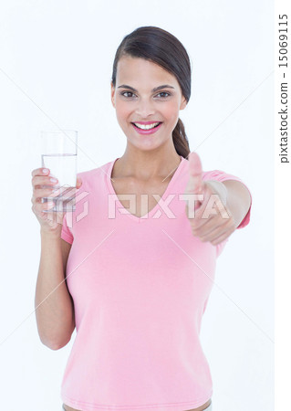 Beautiful woman drinking glass of water with thumb up Beautiful woman drinking glass of water with thumb up 15069115