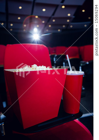 Empty rows of red seats with pop corn and drink 15069294