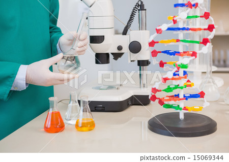 Scientist examining precipitate Scientist examining precipitate 15069344