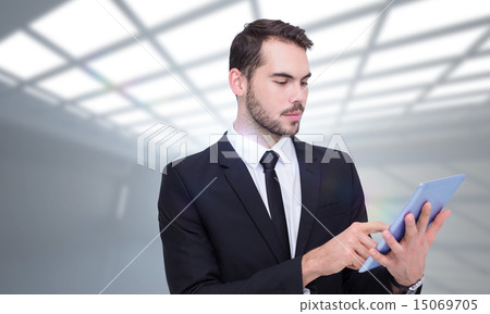 Composite image of cheerful businessman touching digital tablet 15069705