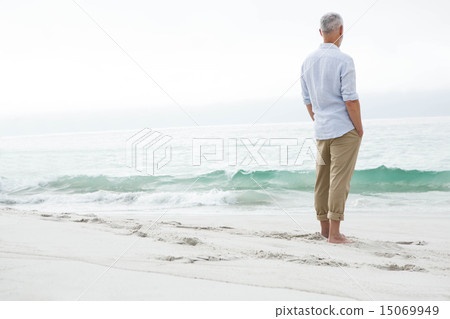 Thoughtful man standing by the sea 15069949