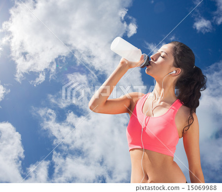 Composite image of beautiful healthy woman drinking water Composite image of beautiful healthy woman drinking water 15069988
