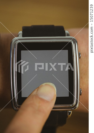 Businesswoman with smart watch on wrist 15071239