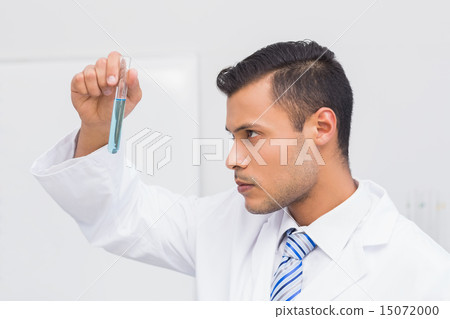 Focus scientist looking at blue precipitate Focus scientist looking at blue precipitate 15072000